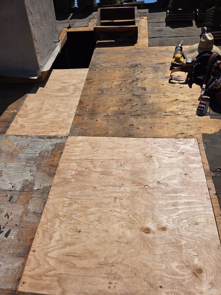wood rot repair in progress beneath tile roof in del mar san diego