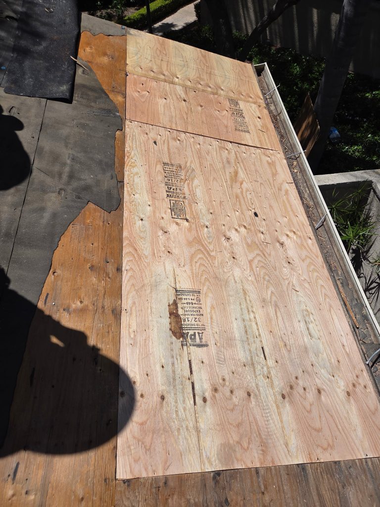 plywood decking exposed after tile removal during del mar roof repair