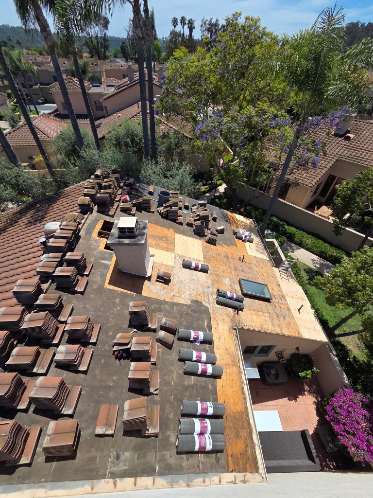 tile roof repair in del mar ca showing underlayment and wood rot