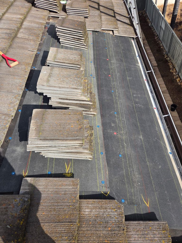 exposed roof deck and underlayment during a targeted tile roof leak repair in santee
